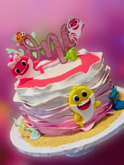 Child's birthday cake with decorations and decadent frosting